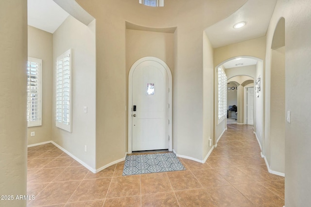 foyer with light tile patterned floors