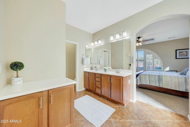 bathroom featuring tile patterned flooring, vanity, and ceiling fan