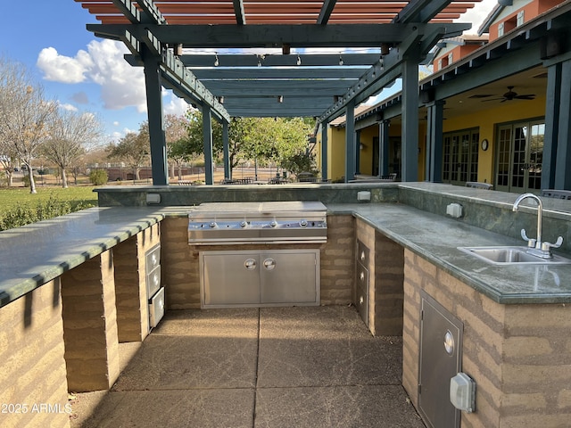 view of patio / terrace with ceiling fan, grilling area, a pergola, and sink