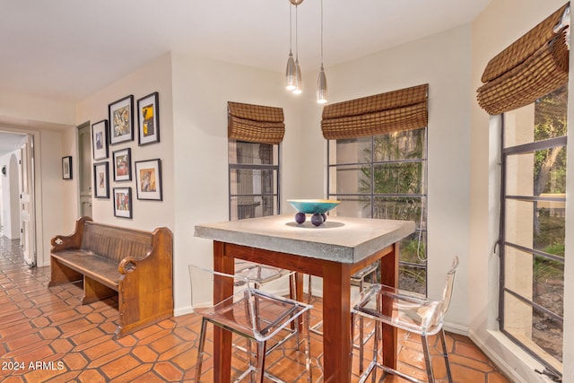 dining area with light tile patterned floors