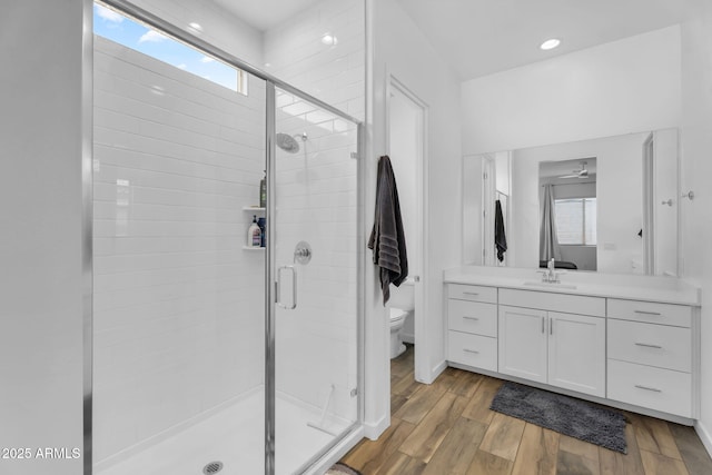 3913 W Mcneil St, Laveen, AZ 85339 - full bathroom with plenty of natural light, a stall shower, toilet, and wood finished floors