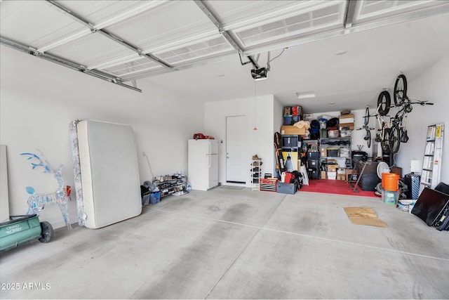 3913 W Mcneil St, Laveen, AZ 85339 - garage with a garage door opener and freestanding refrigerator