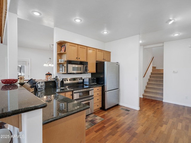 525 E Turkey Trl, Munds Park, AZ 86017 - kitchen featuring appliances with stainless steel finishes, open shelves, dark stone counters, a peninsula, and recessed lighting