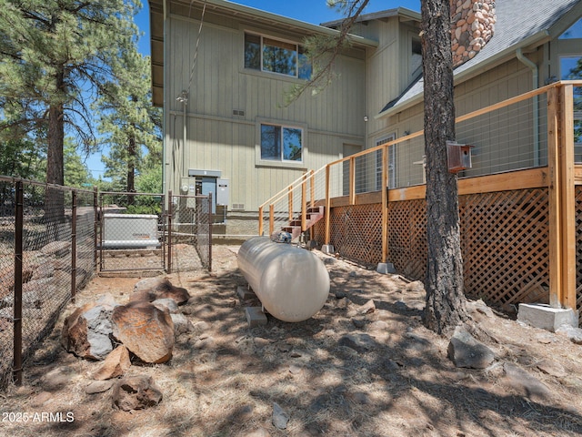 525 E Turkey Trl, Munds Park, AZ 86017 - rear view of house featuring a gate, a wooden deck, and a chimney