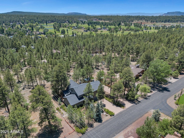 525 E Turkey Trl, Munds Park, AZ 86017 - aerial view of property's location featuring a heavily wooded area and a mountain backdrop