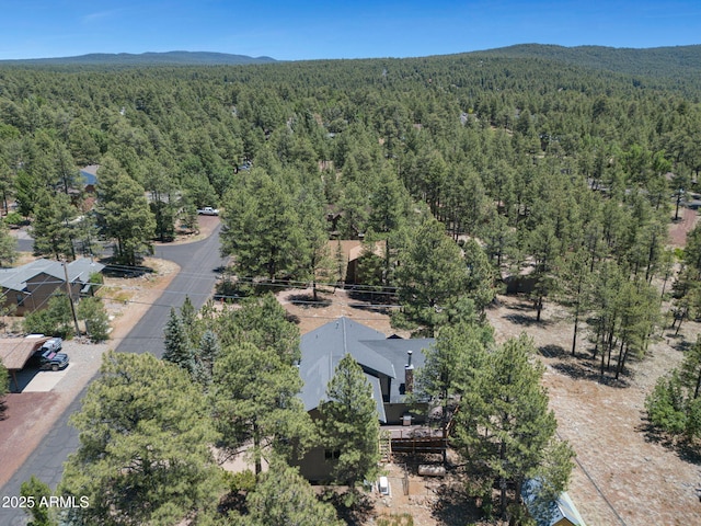 525 E Turkey Trl, Munds Park, AZ 86017 - drone / aerial view of a heavily wooded area and a mountainous background