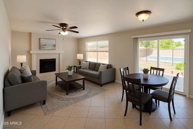 2634 S 63rd Dr, Phoenix, AZ 85043 - living area featuring healthy amount of natural light, light tile patterned floors, and a tile fireplace