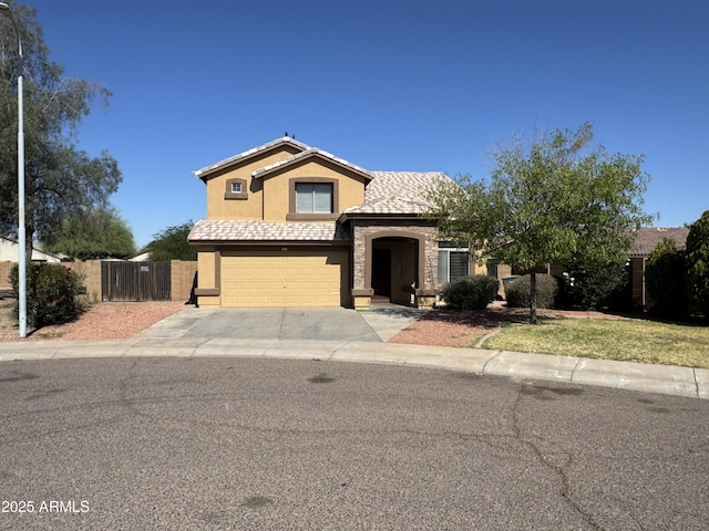 2634 S 63rd Dr, Phoenix, AZ 85043 - traditional-style house featuring a garage, driveway, stucco siding, and stone siding