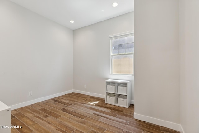20606 E Avenida Del Valle Ct, Queen Creek, AZ 85142 - spare room featuring baseboards, recessed lighting, and wood finished floors