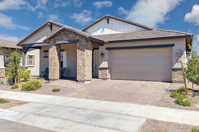 20606 E Avenida Del Valle Ct, Queen Creek, AZ 85142 - view of front facade with a tiled roof, an attached garage, driveway, and stucco siding