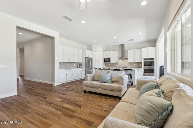 20606 E Avenida Del Valle Ct, Queen Creek, AZ 85142 - living area with recessed lighting, wood finished floors, and visible vents