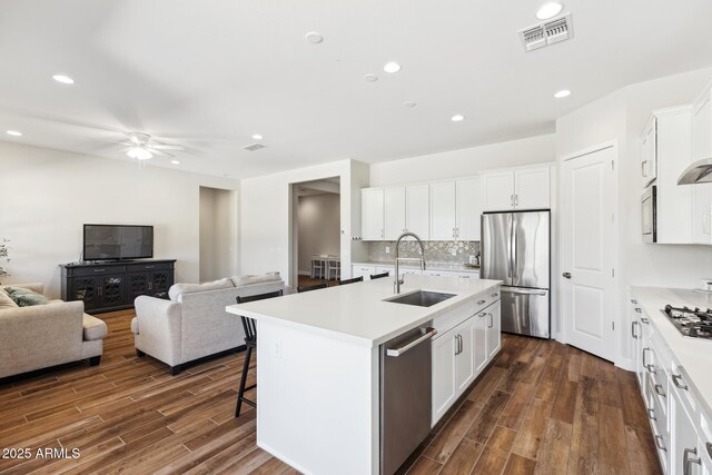 20606 E Avenida Del Valle Ct, Queen Creek, AZ 85142 - kitchen with visible vents, a sink, dark wood-style floors, and stainless steel appliances