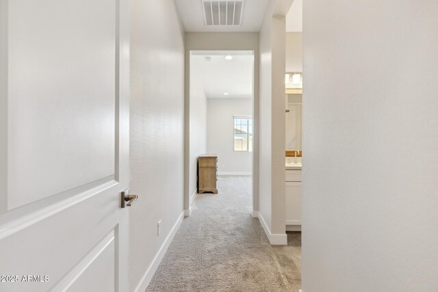 20606 E Avenida Del Valle Ct, Queen Creek, AZ 85142 - corridor featuring baseboards, visible vents, and light colored carpet