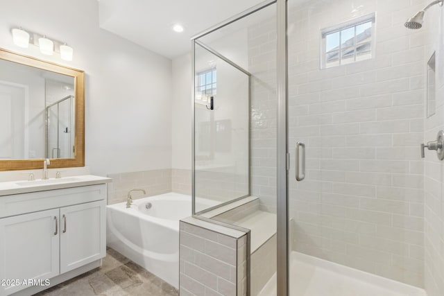 20606 E Avenida Del Valle Ct, Queen Creek, AZ 85142 - bathroom with recessed lighting, a shower stall, a garden tub, and vanity