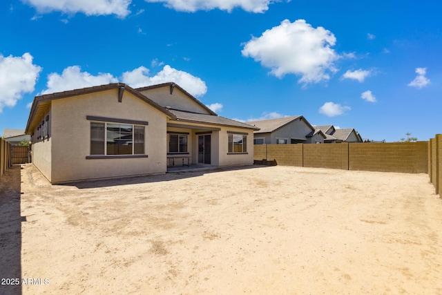 20606 E Avenida Del Valle Ct, Queen Creek, AZ 85142 - rear view of property featuring a fenced backyard and stucco siding