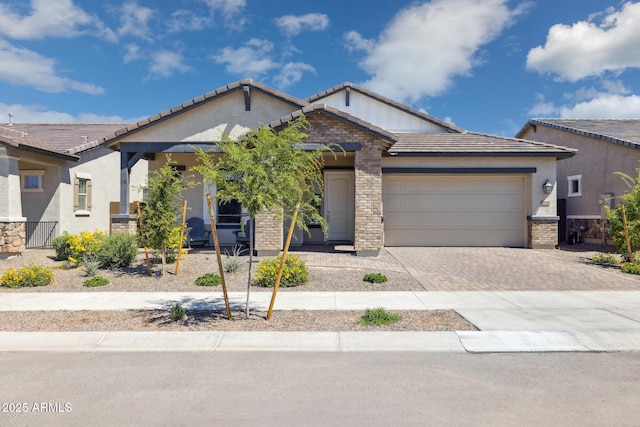 20606 E Avenida Del Valle Ct, Queen Creek, AZ 85142 - ranch-style house featuring stucco siding, a tiled roof, an attached garage, driveway, and a porch