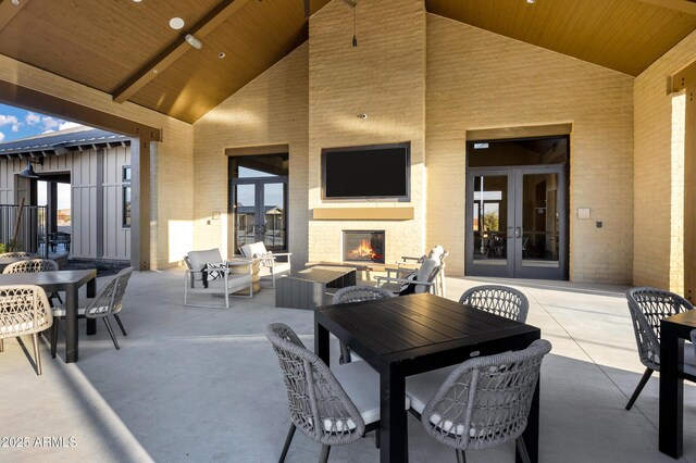 20606 E Avenida Del Valle Ct, Queen Creek, AZ 85142 - view of patio featuring a fireplace, french doors, and outdoor dining space
