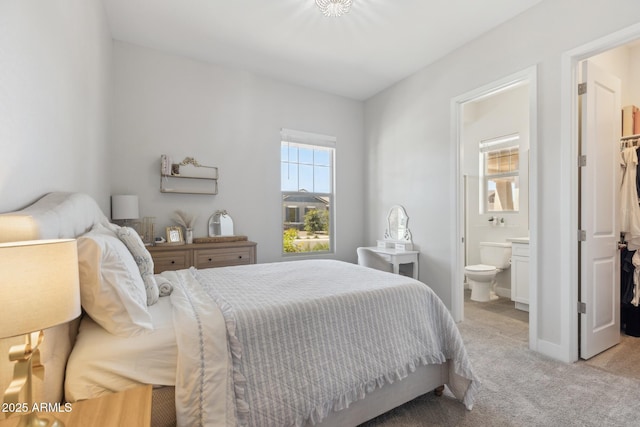 20606 E Avenida Del Valle Ct, Queen Creek, AZ 85142 - bedroom featuring a walk in closet, connected bathroom, and light colored carpet