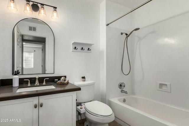 full bathroom featuring shower / bathing tub combination, vanity, and toilet