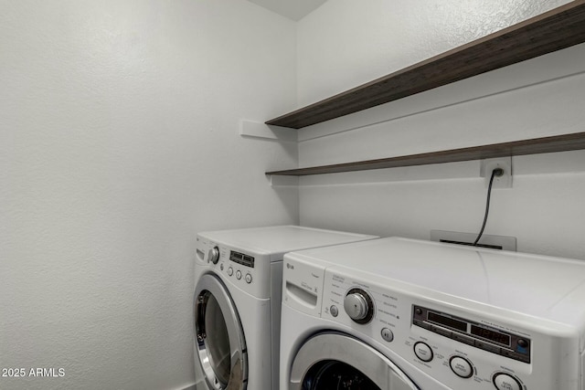 laundry area featuring washing machine and dryer