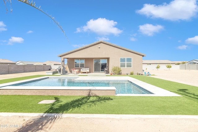 view of pool with a lawn, a fenced backyard, and a fenced in pool