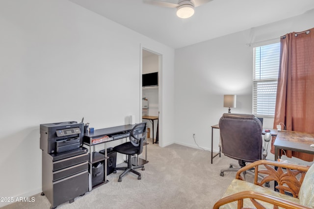 office with baseboards, a ceiling fan, and light colored carpet