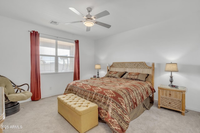 bedroom featuring light colored carpet, visible vents, ceiling fan, and baseboards