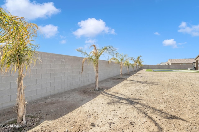 view of yard with a fenced backyard