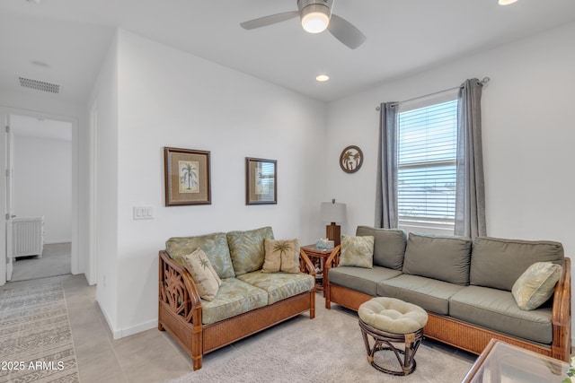 living room with baseboards, recessed lighting, visible vents, and a ceiling fan