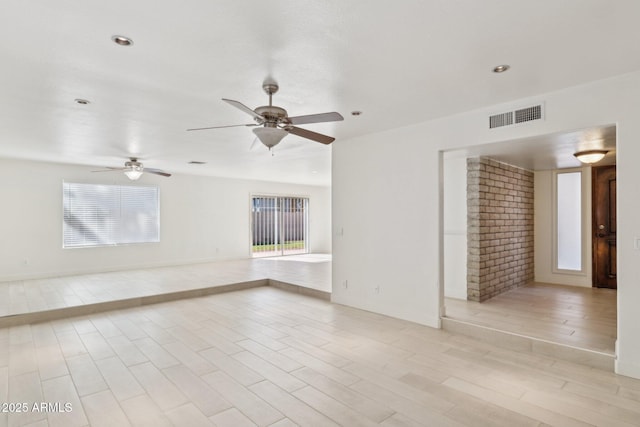 spare room with ceiling fan and light hardwood / wood-style floors