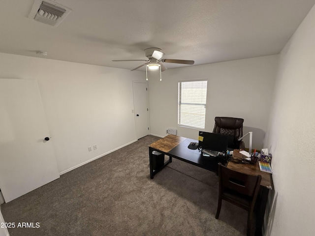 office area featuring ceiling fan, dark colored carpet, and visible vents