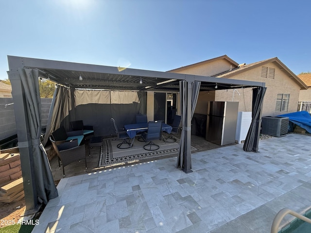 view of patio / terrace with outdoor dining area and central AC unit