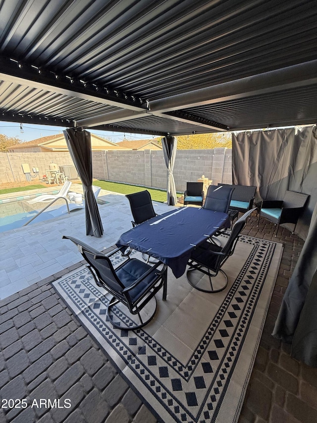 view of patio / terrace with a fenced backyard and outdoor dining area