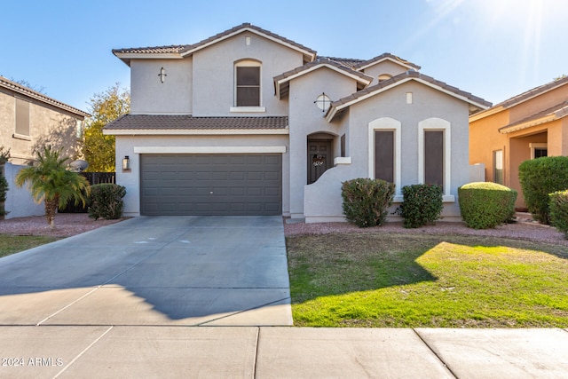 view of front of home with a garage and a front yard