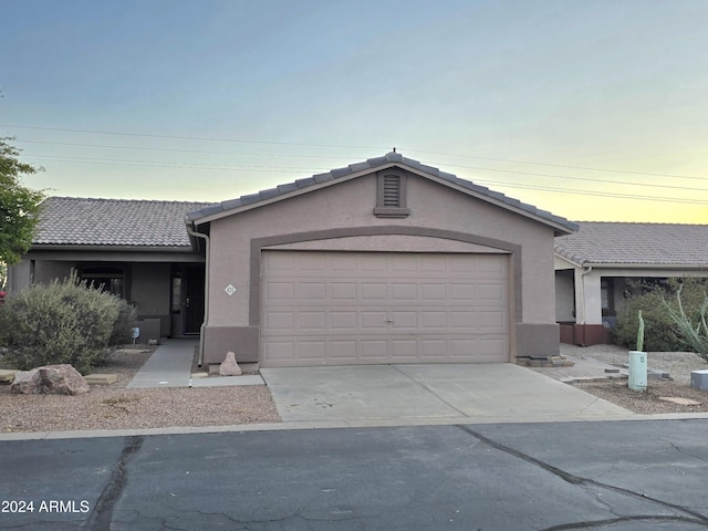 ranch-style house featuring a garage