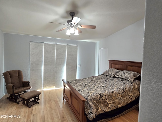 bedroom with ceiling fan and light hardwood / wood-style flooring