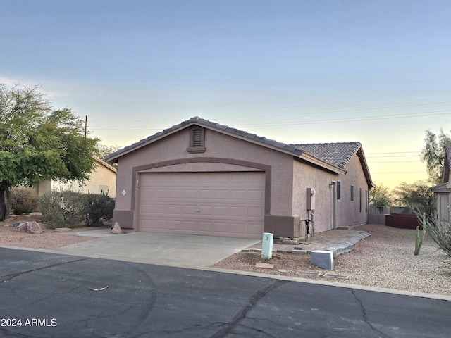 view of front of home with a garage