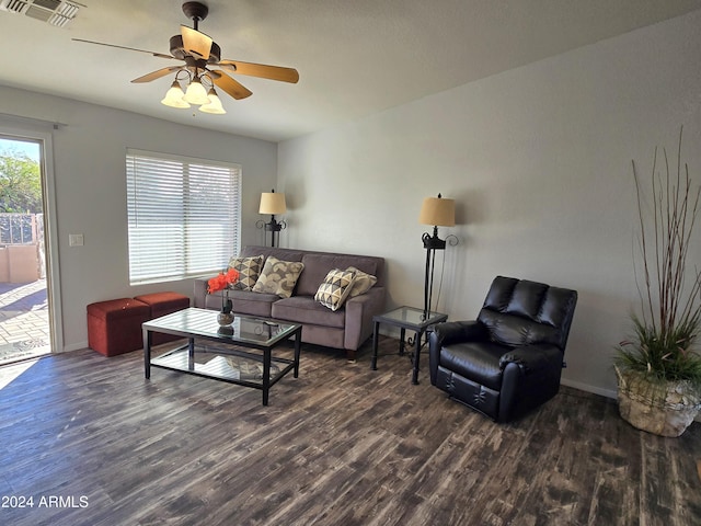 living room featuring dark hardwood / wood-style floors and ceiling fan