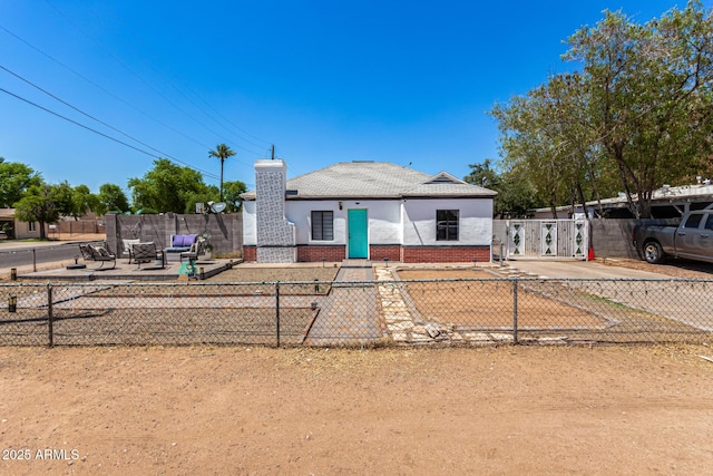 2802 E Virginia Ave, Phoenix, AZ 85008 - view of front facade featuring a chimney, stucco siding, and brick siding
