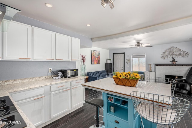 2802 E Virginia Ave, Phoenix, AZ 85008 - kitchen featuring open floor plan, white cabinets, dark wood-style floors, and recessed lighting