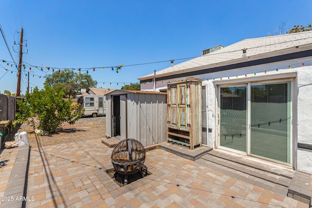 2802 E Virginia Ave, Phoenix, AZ 85008 - view of patio / terrace with a shed and an outdoor fire pit