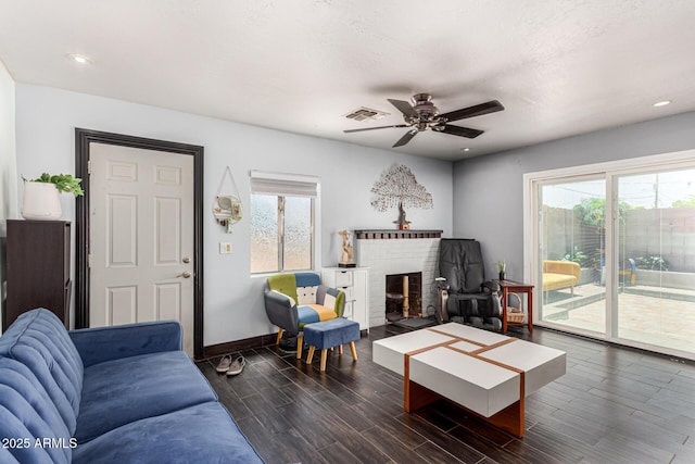 2802 E Virginia Ave, Phoenix, AZ 85008 - living area with dark wood-style floors, a ceiling fan, a fireplace, and recessed lighting