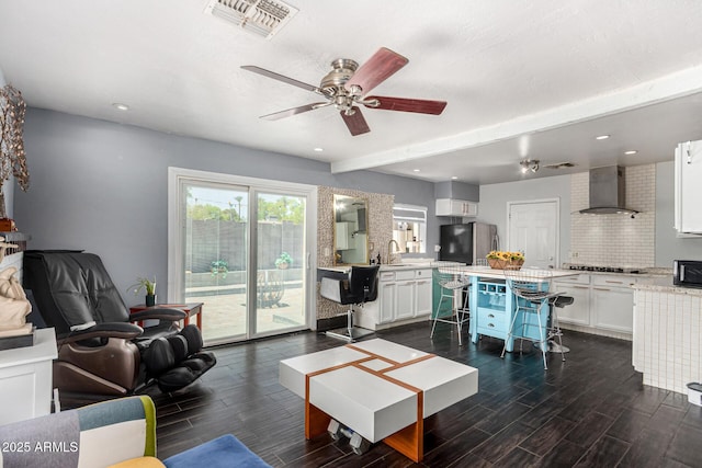2802 E Virginia Ave, Phoenix, AZ 85008 - living room featuring dark wood-style flooring, a ceiling fan, and recessed lighting