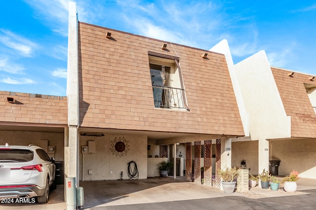 exterior space featuring a carport