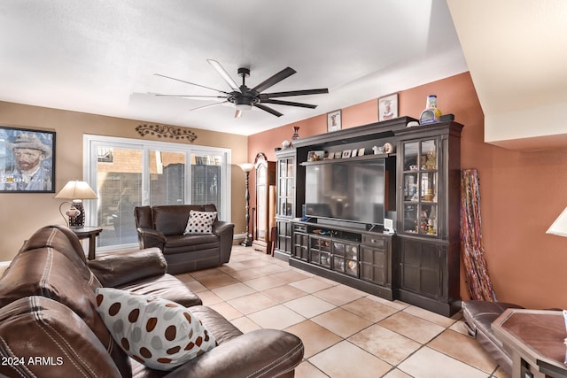 tiled living room with ceiling fan