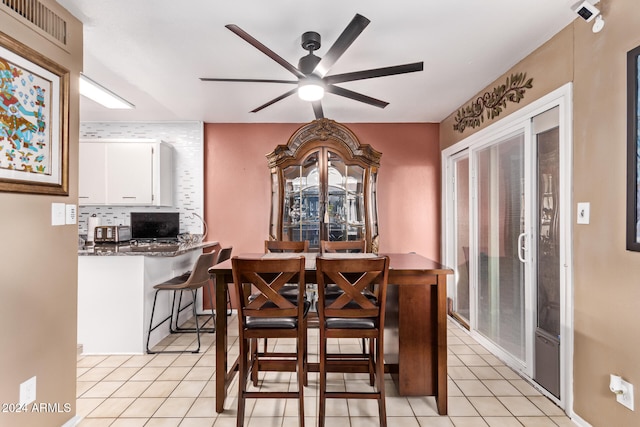 dining room featuring ceiling fan and light tile patterned floors