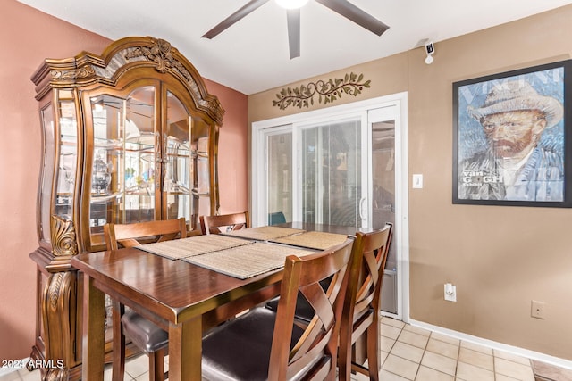 tiled dining space with ceiling fan