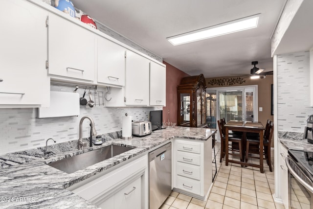 kitchen featuring white cabinetry, sink, and appliances with stainless steel finishes