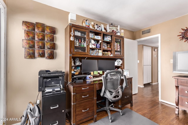 office space with dark wood-type flooring