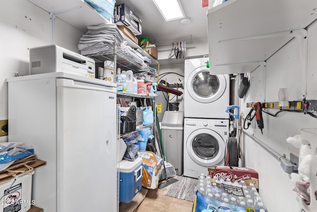 washroom featuring stacked washer and clothes dryer